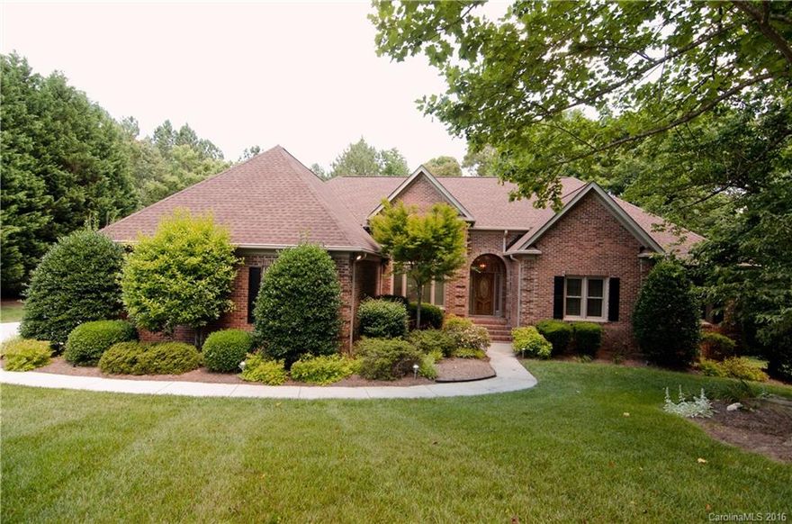 An acre of beautifully landscaped and wooded yard provides a peaceful setting for this four bedroom (owner's suite on main), three and a half bath brick ranch.  Spacious eat-in kitchen opens onto the inviting screened porch and deck.  Kitchen and baths updated with new quartz and fixtures.  Finished lower level has two bedrooms, rec room, hobby room, and full bath and laundry and opens onto the flagstone terrace with fireplace creating a versatile outdoor living space.  Fresh paint throughout.