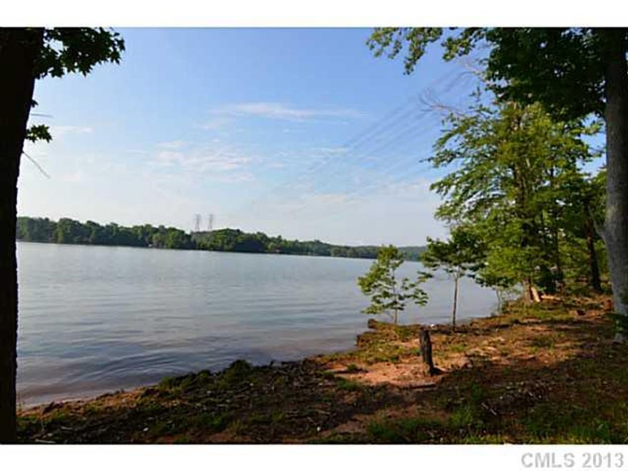 WOW! Great opportunity - 166' of dock-able waterfront on Lake Wylie. Gated resort style living just a 25-30 minute commute to Uptown Charlotte.  Lot is suited for custom built walk-out basement.  No build times, work with one of the community builders or bring your own. Amenities: Clubhouse, pool, tennis courts, walking tails, recreation/soccer field, waterfront pavilion and much more.  City water, sewer and natural gas utilities.  Must see lot if looking to live in Belmont on the water.