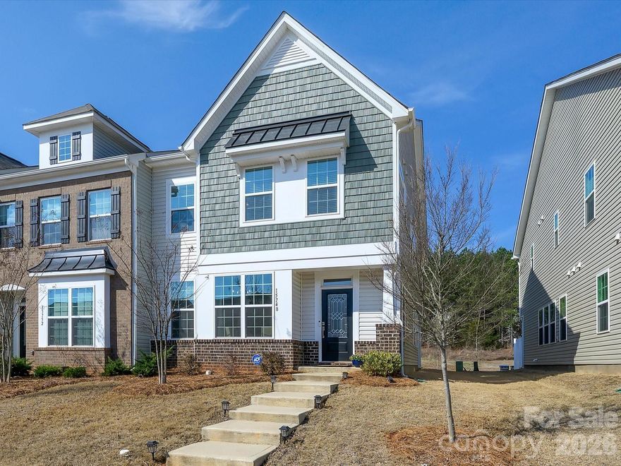 This stunning end unit townhome in desirable Chateau shows like a model home.  As you enter you are greeted by high ceilings and upgrades galore - from the built in desk and shelves in the home office to the beautiful light fixtures throughout and Hunter Douglas shades.  The open floor plan is bright and airy, with the gourmet kitchen at it's very heart.  Gorgeous cabinetry, a huge island and walk in pantry make living and entertaining a breeze.  Outdoors, the covered side patio is the perfect place to relax with a cup of coffee in the morning, and the back yard is the perfect spot of nature.  At the top of the stairs the iron balusters frame the cozy loft area that separates the primary bedroom from the other two sizable bedrooms; one is decorated as an adorable nursery!  The primary suite is a true retreat, large with decorative molding on the walls, a huge walk in closet and a large walk in shower with tile surround.  This community has ample parking for guests in addition to the garage and driveway and features a community pool and cabana.  Great location minutes from I-485 and I-77, and Rivergate Shopping Center with a huge array of shops and restaurants, this home can't be beat!