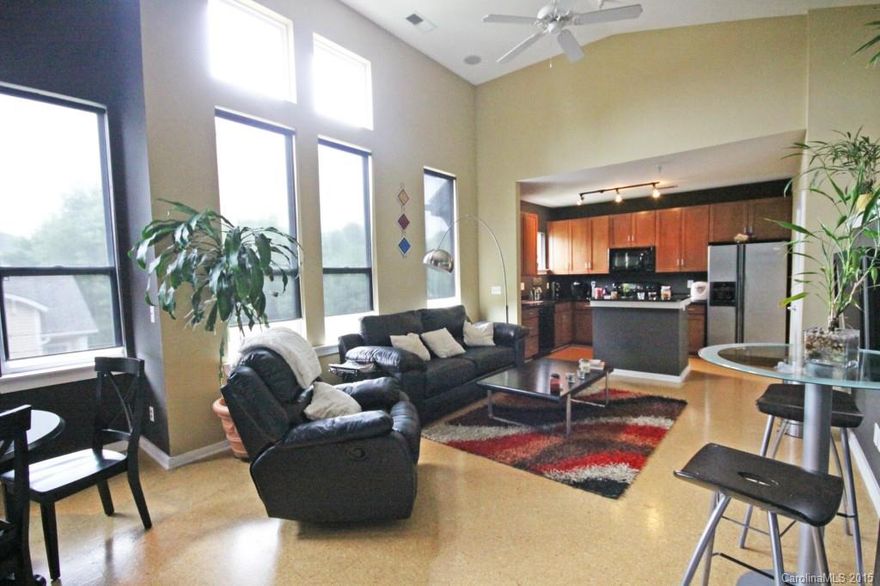 This spacious 1br/1ba Penthouse corner unit at Optimist Park is convenient to everything! Steps away from Uptown & the new light-rail station proposed at Parkwood makes this unit perfect for easy travel to work, entertainment, sports & dining. This unit features high vaulted ceilings w/ large windows letting in natural light w/ views of the Uptown skyline. Condo has been wired extensively with surround sound throughout. Computer niche in bedroom; kitchen boasts granite countertops & large island