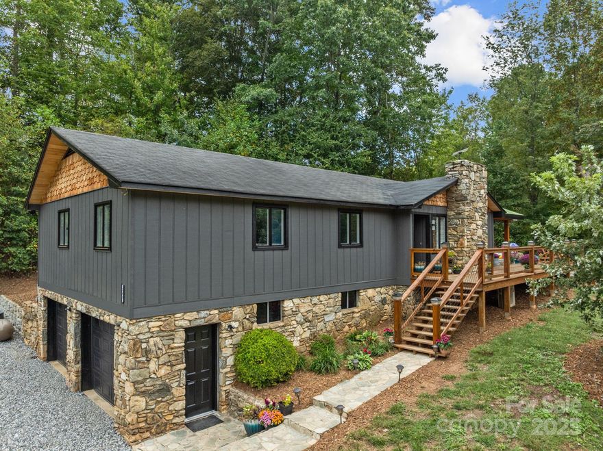 BACK ON MARKET DUE TO FINANCING! -Mountain Retreat with Incredible Views! Enjoy modern comfort, scenic beauty, and endless possibilities with this exceptional mountain property. Set on terraced land with sweeping Blue Ridge views year round it is a perfect private retreat.Updated 3BR/2.5BA contemporary ranch with 2 bonus rooms used as bedrooms, stylishly remodeled tile baths, and a luxurious primary suite with soaking tub & walk-in shower.  Spacious kitchen eat-in kitchen with large island and tons of storage!   Full basement with 2-car garage, mudroom , expansive decks with large covered area , stamped concrete patio, and fire pit for enjoying cool, crisp mountain nights! There is a barn with chicken house, garden space, ample parking, and level site for future build, greenhouse, or RV pad..A rare opportunity with panoramic views and unmatched flexibility — ideal as a homestead, or income-producing retreat. Original owners used property for horses. Barn could be converted back to horse barn. Endless possibilities for any vision make this property a rare treasure!