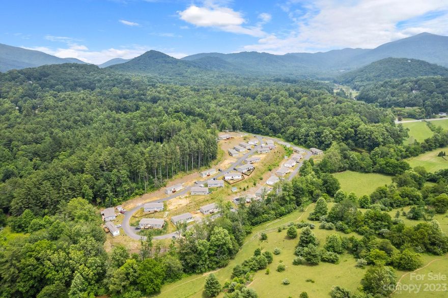 Don't miss this newer mobile home park in excellent condition that offers a turn-key investment opportunity! Everything in the park has been recently developed since 2020. 34 pads total, currently 6 park owned homes, 24 lot leases, 4 vacant pads that are in queue to be filled (lot lease or park owned home options for a new owner). Wastewater is served by an on-site treatment system. Community water system. Underground electricity. Cable service available to tenants. Community mailbox and a nice pavilion by the creek. The park is surrounded by bucolic farmlands, offering a pleasant setting that is unusual for a MHP. Information on file (upon request) includes engineering documents, income + expenses, rent roll, leases, insurance, rules & regs, permits, and more. All considered, this well-maintained park offers a great investment opportunity for established cash flow, quality tenants in place, and ease of long-term ownership, all with a desirable location only 20 minutes from Asheville.