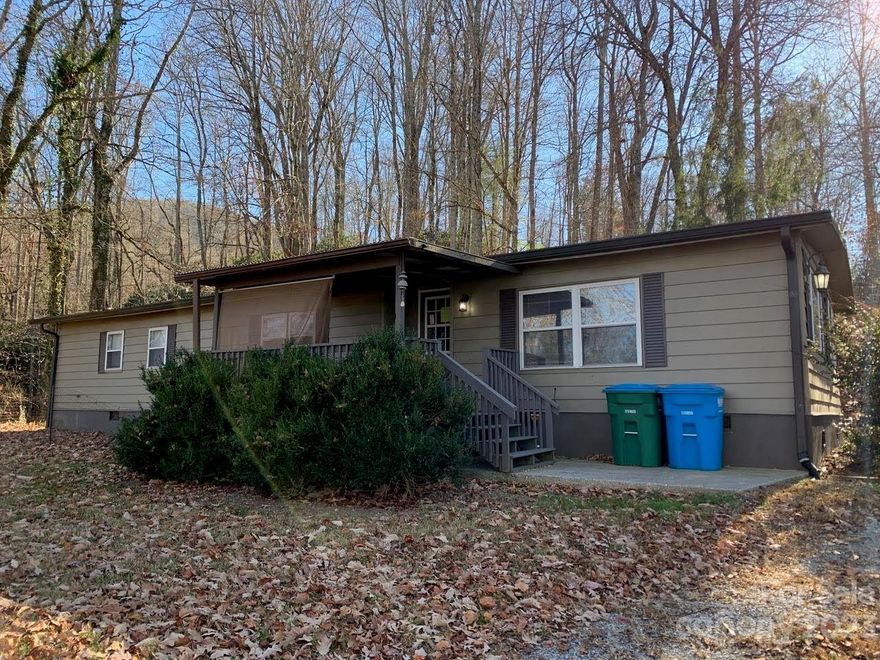 This 1536 SF 3 bedroom/2 bath doublewide sits on a beautiful 3/4 acre privately owned wooded lot with large trees. It has a nice front yard with a small, fenced side yard.  It shares the lot with one additional singlewide, 
# 810, which is included in the sale. This second unit can be leased as an additional income source. The list of updates for # 806 includes vinyl window replacement, painting throughout, vinyl plank laminate flooring throughout, both bathrooms have been completely renovated and the kitchen updated. Appliances include refrigerator w/ice and water in door, smooth-top stove, and dishwasher. It has an open floor plan, separate dining area, den-like area with wood burning stove, spacious covered front deck and a back deck, with extra storage. It has central heat and air. There are lots of windows in this home making it very light. There are washer and dryer hookups. Fletcher Park with walking and biking trails, picnic areas, a stream, & ball fields is just 4 miles away.