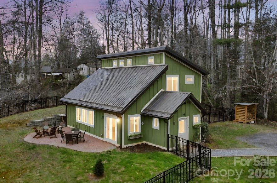 Welcome home, this is the one you’ve been waiting for. Tucked away on a private yet convenient 1.5-acre double lot, this turnkey mountain contemporary home offers the perfect blend of comfort, style, and opportunity. Sold furnished, minus a few personal items, this is a true move-in or rent-ready property. 
With just over 1,500 square feet, 3 bedrooms, and 2 full bathrooms, the home features soaring vaulted ceilings and an open-concept layout that lives much larger than its footprint. Warm pine ceilings and exposed timbers, harvested right from the property, bring an authentic mountain feel, while the energy-efficient, highly insulated construction keeps the home comfortable year-round.

The updated kitchen is both functional and stylish, complete with granite countertops, stainless steel appliances, soft-close drawers, and a gas propane range. At the heart of the home, a striking brick wood-burning stove with cooktop and warming oven serves as both a centerpiece and a practical feature, perfect for cozy nights or hosting guests.

Step outside and take it all in. The newly expanded brick patio is ideal for entertaining, unwinding, or soaking in winter mountain views, while the large, newly fenced yard is perfect for pets, gardening, or simply enjoying the outdoors. A versatile utility shed adds extra storage, and the additional lot included offers exciting potential for future expansion or possible subdivision.

If you’re looking for a full-time residence, a weekend escape, or an income-producing short- or long-term rental, this property checks all the boxes. Located just 15 minutes to downtown Asheville and 8 minutes to the Blue Ridge Parkway, you’ll enjoy easy access to local breweries, dining, and everything Western North Carolina has to offer.

The possibilities here are endless.