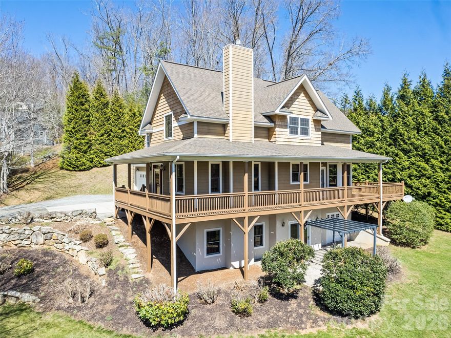 Beautifully crafted one owner home in the sought after Newfound area, where quality materials and timeless design come together just minutes from I-40 and approximately 20 minutes to Asheville or Waynesville. This thoughtfully designed residence offers the ease of main-level living paired with exceptional, locally sourced finishes throughout. Rich white oak hardwood floors, harvested and manufactured in Haywood County, flow through the home, complemented by stunning soft maple walls and ceilings in the living room and gas log fireplaces with elegant cherry mantels. The kitchen showcases custom cherry cabinetry, also locally harvested and crafted, blending warmth and quality with everyday functionality. Designed for both comfort and entertaining, the home features a spacious family room with wet bar, a versatile loft, and two bedrooms upstairs along with full baths on each level along with half bath on main. Enjoy outdoor living from the covered porch or patio, perfect for taking in the peaceful surroundings. A double attached garage and abundant storage throughout the home provide both convenience and practicality without compromising style. Schedule your private showing today and experience the craftsmanship and comfort this home has to offer.