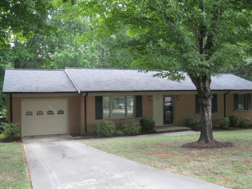 This is a must see. Well cared for immaculate home in great neighborhood in Moor. Over an acre lot mature trees front and back, all brick. Hardwoods under carpet inside except in den. Mooresville sch. Home has 1.5 baths. Lots of kit cabinets, single garage. private backyard, quiet street.  Breakfast area also a dining LR combination. Truly a well kept home!!!!!!