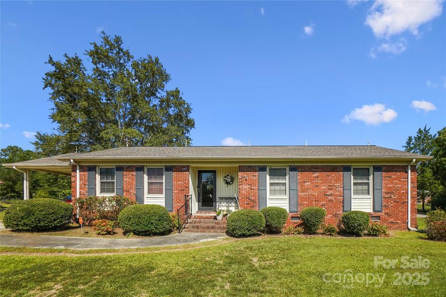 Welcome Home!
This charming all-brick residence sits on a desirable corner lot and offers 3 spacious bedrooms and 2 full bathrooms. Inside, you’ll find beautiful hardwood flooring and an open floor plan, where the cozy living area flows seamlessly into the dining area. The kitchen features ample counter and cabinet space, perfect for everyday living and entertaining. The master suite includes a walk-in closet for added comfort and convenience.

Outside, enjoy the peaceful backyard setting with two small storage buildings, ideal for hobbies or extra storage. A 2-car carport adds convenience to this inviting home.