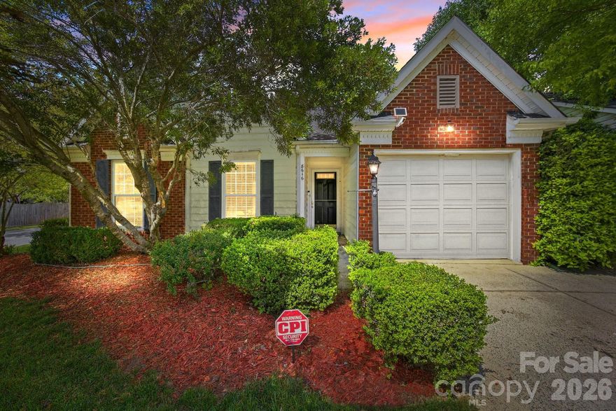 Welcome home to this charming brick and vinyl ranch perfectly situated on a desirable corner lot. This meticulously maintained one-story floor plan features an expansive great room with a soaring vaulted ceiling, a ceiling fan, and a cozy fireplace, creating an inviting atmosphere for relaxation or entertaining. The spacious kitchen offers an abundance of cabinet and countertop space and comes fully equipped with a suite of appliances including a gas range, dishwasher, and refrigerator— approximately two years  and microwave. The washer and dryer are included. Adjacent to the kitchen is a large, bright dining area ideal for family meals. The primary suite serves as a true retreat, boasting a vaulted ceiling, a large walk-in closet with custom built-in, and a spa-like ensuite bath featuring a garden tub, a separate shower, and two separate sink areas. Two additional generously sized guest bedrooms and a full bath, providing excellent privacy through the split-bedroom layout. Outside, you will find a single-car attached garage featuring a brand-new garage door opener and a private backyard oasis complete with a patio area, a dedicated garden space, and a mature shade tree in the front yard. This brick and vinyl home also includes full gutters for easy maintenance. Conveniently located with easy access to I-485, I-77, and I-85, you are just minutes away from premium shopping, dining, and healthcare facilities.