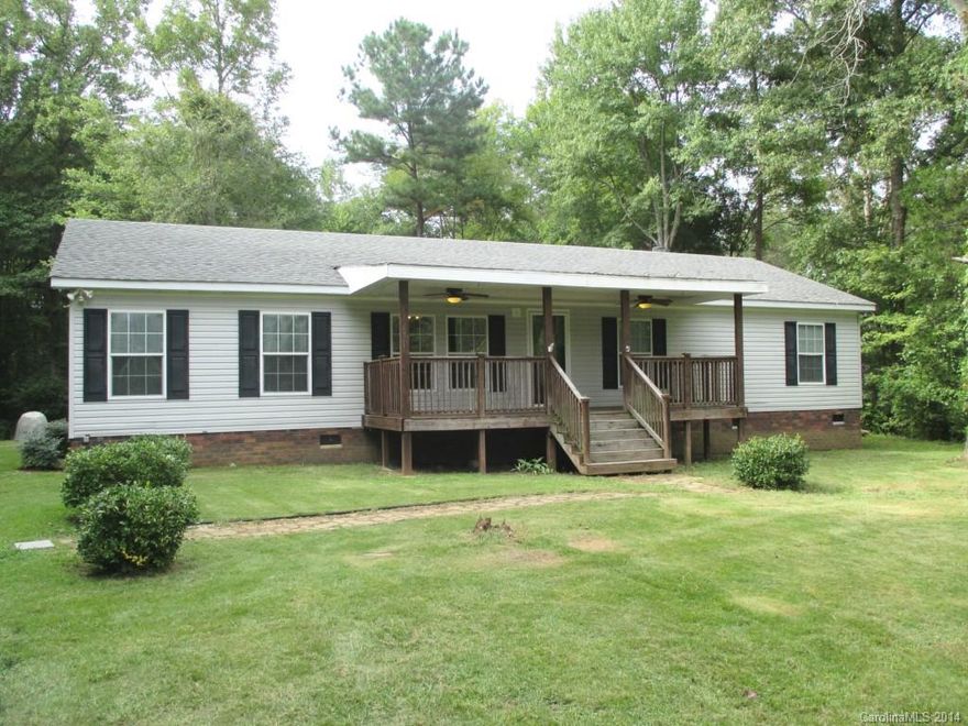 This is a custom modular home nestled on 1+ private acre lot!  Ready to move in!  Enjoy your privacy on the rocking chair front porch.  Formal LR greets you as you walk thru the front door.  Huge kitchen with lots of cabinets.  GR boasts a stone stacked wood burning fp.  Master suite with 2 sinks, garden tub and sep shower!  2 additional br’s with large closets.  Ceilings fans in almost every room!  Eligible for 100% USDA financing per the USDA website.