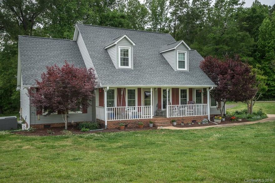 Welcome to country living at it's finest! This house sits on 5 acres that backs up to a pond! This is a country lovers dream!  Whether you are sitting on the front porch drinking tea or watching wildlife from your back porch, this house offers great views.  Be sure to host barbecues all summer long. Master on the main floor.   The ceramic tile kitchen counter and backsplash offer a contemporary feel.  The vaulted ceilings give the house a light, open feeling. This house won't last long!