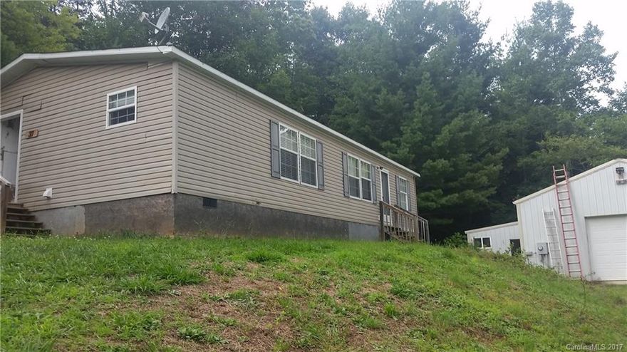 East Side Gem!!!  2007 Clayton manufactured home with 3 bedrooms and 2 bathrooms. Highly desirable flat .41 acre lot.  Great location!!  Less than 15 minutes to downtown. Separate 1,000+ SF Heated Workshop and garage!  Wonderful quiet road.  Minutes to the VA, Blue Ridge Parkway and Asheville.  Bring your tools, your hobbies, or  your cars.   Plenty of room for a garden, backyard fire-pit, easy parking.  A Must See!!  Won't last long!