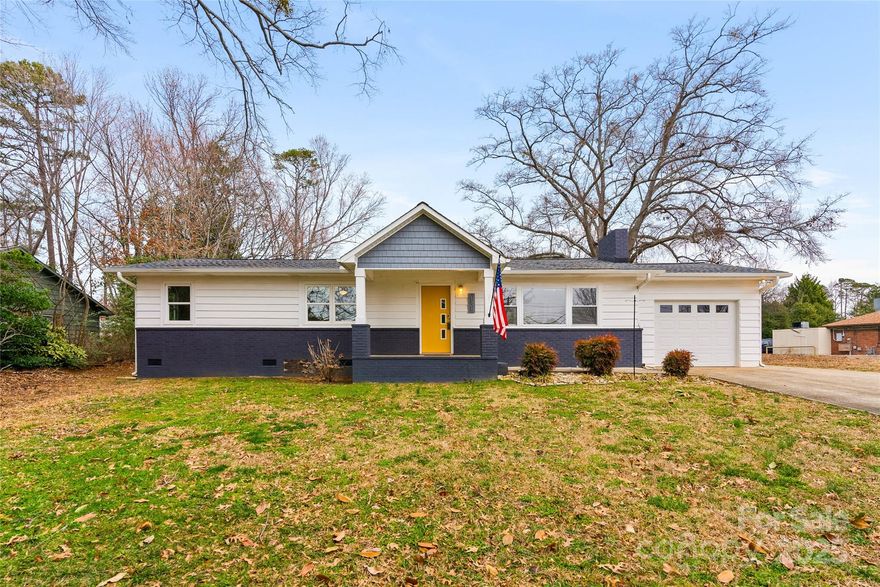 Located in the heart of Landrum, this beautifully updated 3BR/2BA home was taken down to the studs in 2018, with a new roof, HVAC, windows, plumbing, electrical, gas tankless water heater, and ductwork—all updated at that time. The open-concept layout features hardwood floors, a gas log fireplace with real wood paneling, and large vinyl windows for natural light. The oversized kitchen boasts quartz countertops, a gas range, walk-in pantry, island, and glass-front cabinets. The primary suite includes a tile shower, dual vanities, a walk-in closet with laundry, and a built-in desk area. A detached 20x20 metal shop with power, a sink, and a fan for perfect climate controlled storage environment. Fully fenced yard! Walk to Brookwood Park, OP Earle Elementary, and downtown. Located next door to Caro-mi restaurant - opening soon!  Easy access to I-26, Saluda, Hendersonville, Inman, and Spartanburg. Spartanburg Co. District One best buy!  C-2 zoning - Air BNB/some commercial use.