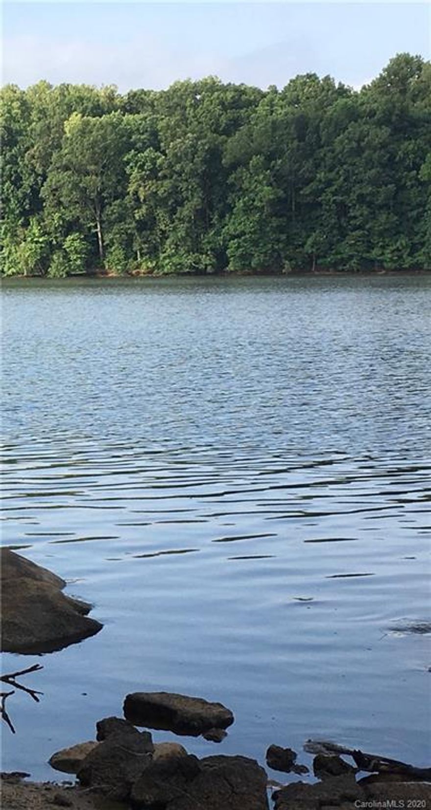 1.5AC Waterfront lot with 205' of shoreline, qualifies for a private pier, close to the main channel of High Rock Lake and perfectly sloped for a walk out basement. Don't miss out on this lot, so few left that have a view like this.  Located in the gated community of Sunset Pointe in Rowan County.  5 min. to I85, 40 min. to Greensboro and Winston Salem, hour to Charlotte Airport. Community offers community boat ramp, Club House with work out room, pool, tennis courts, basket ball court.   http://www.sunsetpointeonhighrock.com/