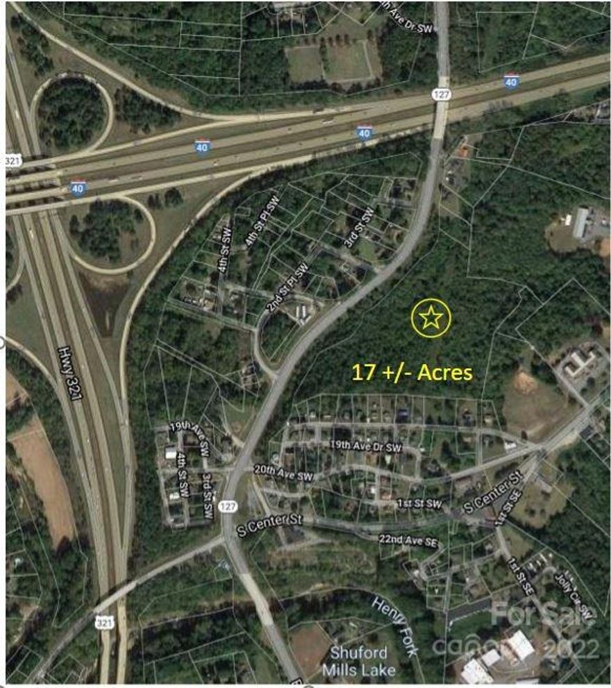 Incredible Opportunity to Own over 1000 FT of Road Frontage on HWY 127 S Headed In To MTN View.17+/- Acres of Raw Land with additional access points from S Center St and Catawba Valley Blvd. This land provides amazing access to I-40, Hwy 321, Hwy 127, and Hwy 70. Unlimited Potential!
