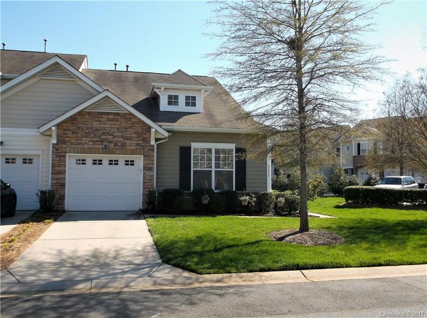 Immaculate 2 bd/2 bath end unit w/ one car garage. Very open flr plan. DR area, spacious kitchen w/ granite, ceramic tile, lots of cabinet space, pendant lights, large master w/ tray ceiling, deluxe master bath w/ sep garden tub/ shower. Large walk in closet. Updated light fixtures. Office nook by laundry rm. This home shows like a model home!