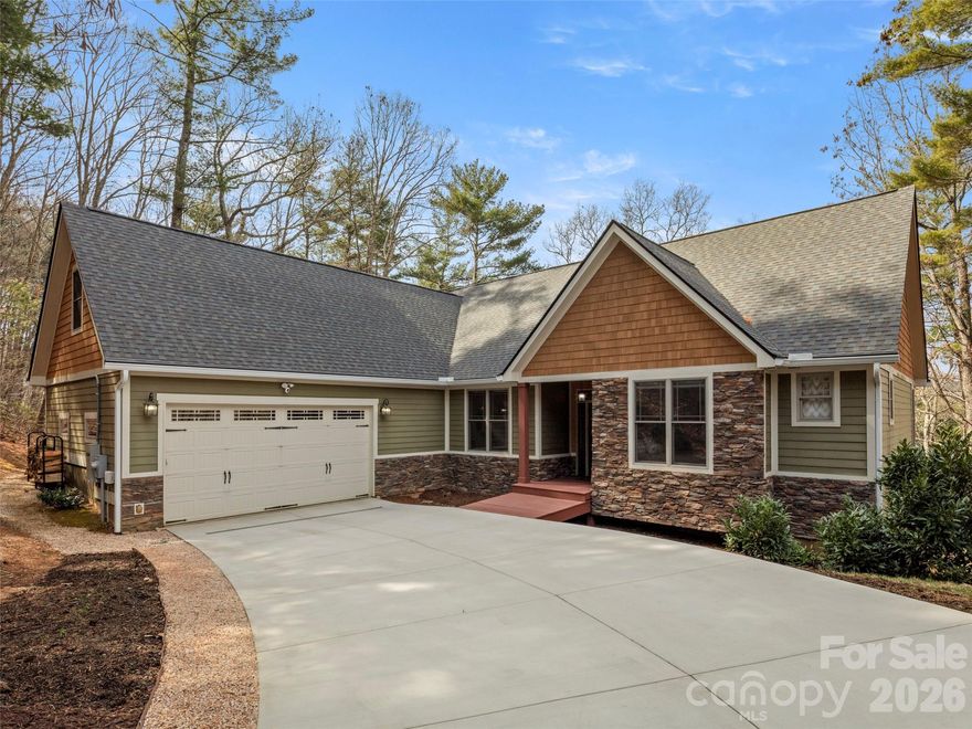 Tucked among the trees just 10 minutes from vibrant downtown Asheville, this hidden oasis offers the perfect balance of peaceful seclusion and everyday convenience. Surrounded by private wooded views, this home lives like a true treehouse, where sunlight pours through and nature becomes part of the experience in every room. Meticulously maintained and thoughtfully designed for comfortable main-level living, the home features inviting, light-filled spaces that flow seamlessly for both daily living and entertaining. A charming second-level suite offers the ideal guest retreat or inspiring home office, while the expansive terrace level provides incredible flexibility, perfect for a game room, hobby or craft studio, or even a private in-law suite complete with a full bath and kitchenette. Dual-level decks invite you to relax and unwind while enveloped in wooded serenity, with seasonal winter mountain views adding to the home’s natural beauty. Recent improvements include a newly paved driveway, new lighting throughout, a new roof and gutters, and a whole-house generator. Private, serene, and just minutes from Asheville’s celebrated dining, shopping, and arts scene, this mountain retreat offers the best of both worlds.
