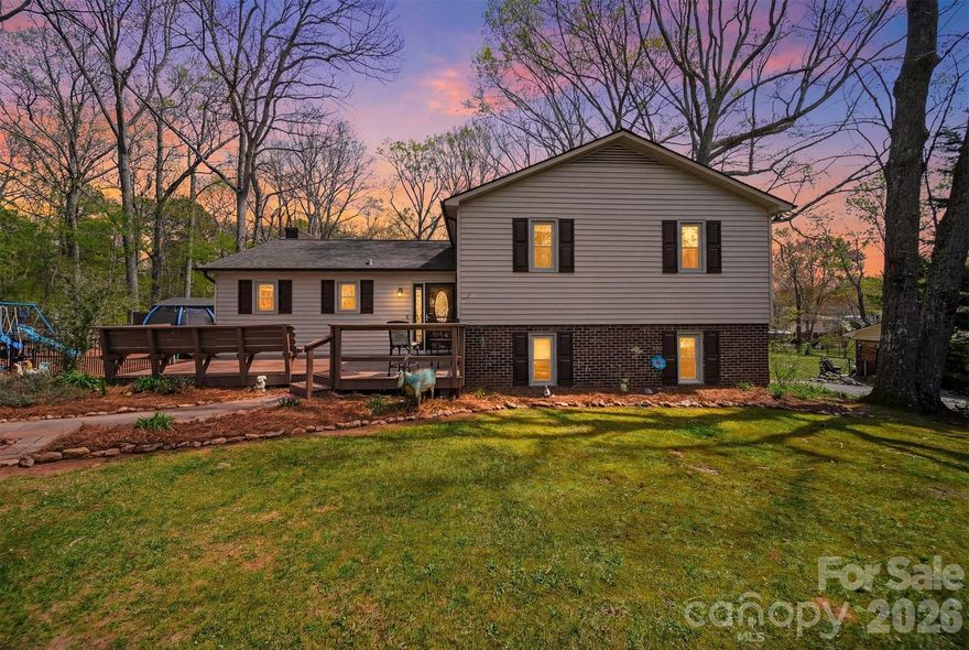 Welcome to this charming 5-bedroom, 2-bath home located in the desirable Highland Park area of Lincolnton, offering a unique blend of farmhouse-inspired character, functional living space, and a peaceful outdoor setting—all with no HOA.

Inside, you’ll find an inviting eat-in kitchen featuring farmhouse-style cabinetry, warm wood accents, and ample space for gathering and everyday living. The home’s living areas are filled with character and include a beautiful stone fireplace that adds warmth and charm. A basement-level recreation room provides flexible space that can be used as a playroom, media room, hobby area, home gym, or additional entertaining space.

The outdoor spaces truly set this property apart. The front yard features a well-maintained koi pond, home to several resident koi, including the largest and most notable, Dino. The backyard offers a spacious new deck, raised garden beds, a compost area, and two storage sheds, creating a functional and enjoyable space for gardening, entertaining, or relaxing.

Conveniently located less than 5 minutes from Atrium Health Lincoln, grocery stores, home improvement stores, dining, and Interstate 321, this property offers the perfect combination of privacy, convenience, and usable space.

A rare opportunity to own a home with character, flexibility, and outdoor appeal in a convenient Lincolnton location.