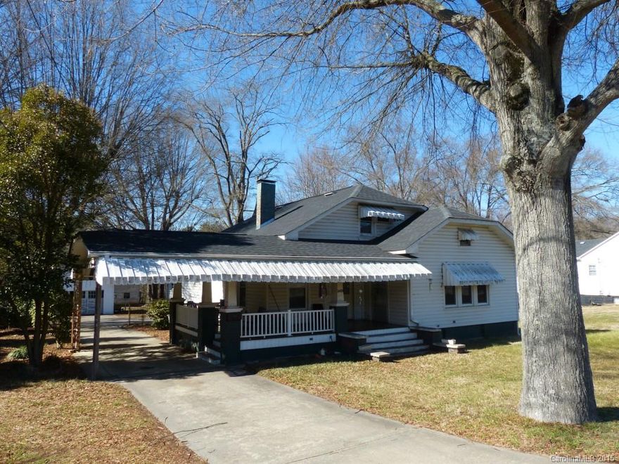 Charming 1920's bungalow with hardwood floors in most areas,  strong potential, huge det 2 car gar,
Second floor is not serviced by central HVAC, warm in winter, cooled by window units in summer. Lovely wrap front porch, summer kitchen in basement with lots of extra space in walk out basement level.  out buildings.
property to be conveyed "as is"   original fireplaces have been covered. Original parcel was sub-divided, tax value showing in MLS is that of original . Level yard .