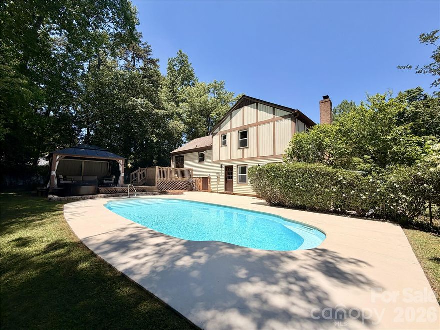 Welcome to this beautifully updated, move-in ready home in the highly sought-after Sardis Woods neighborhood! An open, flexible floor plan designed for comfortable everyday living and effortless entertaining. The updated kitchen showcases crown molding, quartz countertops, subway tile backsplash and excellent flow into the main living spaces. The lower level offers a spacious family room with a cozy gas log fireplace, custom built-ins, and a private guest suite ideal for visitors, multi-generational living, or a home office. Enjoy seamless indoor-outdoor living with direct access to the incredible backyard retreat featuring a saltwater in-ground pool, expansive terrace deck, cabana, and a fully fenced, park-like backyard perfect for relaxing or entertaining. Located just steps from the walking trails at McAlpine Creek Park and minutes from shopping, dining, Downtown Matthews, SouthPark, and Uptown Charlotte, this home combines location, lifestyle, and charm.