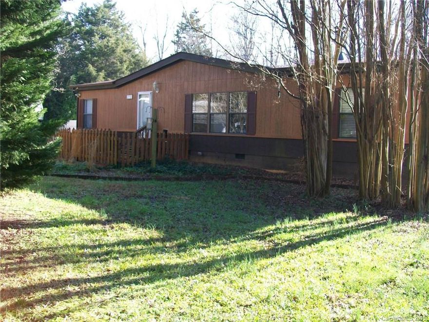 Completely remodeled 3 Bedroom 2 Bath Doublewide on 2 acres. Gas range cooktop, Double Oven, refrigerator, dishwasher and washer & dryer. Fireplace. New paint, new flooring and french drain installed. Nice deck, wired workshop, fenced in back yard. Plenty of room to run and play. This home is ready to move in.  100%  USDA  Financing