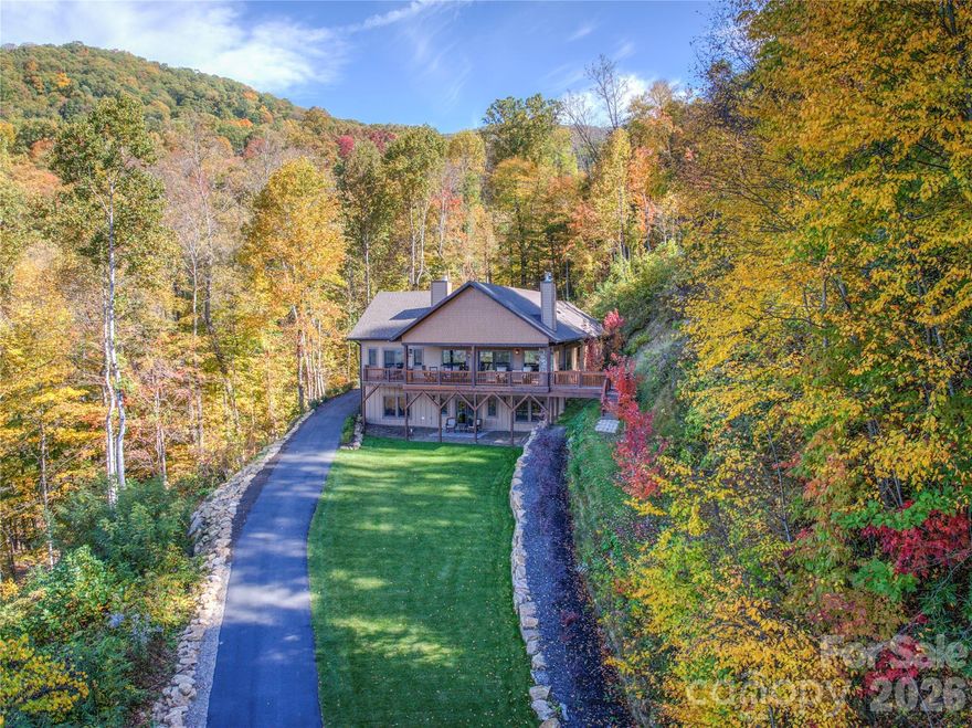 Built in 2025 this one of kind 5.7-acre property is only minutes to beautiful and newly renovated Waynesville Inn golf course! Fantastic views and easy access from this 4BR 4 bath home located in the prestigious Sanctuary Cove. Property is in the city limits with city sewer and water and less than 10 min to historic Waynesville. This custom-built Craftsman style home welcomes you with an open-concept layout featuring a designer kitchen with custom cabinetry, island, high-end counters, backsplash, and top of line appliances. The spacious living and dining areas flow seamlessly together perfect for entertaining or relaxing by the stone fireplace while taking in the beautiful mountain views! Main-level primary suite with vaulted wood ceilings and large custom bath. There is an additional large bedroom/office on main floor. The lower level features a family room, wet bar, and more great views!  Large guest bedroom with en-suite and additional bedroom. This stunning luxury residence, expertly designed to blend sophistication and comfort for the ultimate mountain lifestyle.  Every detail of this home showcases high-end finishes and expansive windows that flood the interiors with natural light, creating a bright and inviting atmosphere. The unique barnwood flooring runs thru the main level. Walk out to the covered 700sf patio with stone fireplace and sun deck. There is also a Generac whole house generator and full stand up storge above garage with pull down stairs . Note the low HOA Dues