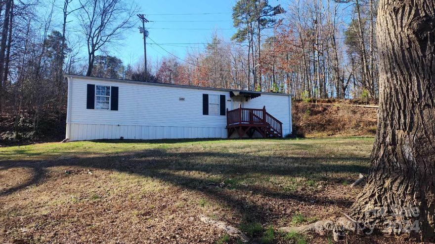 Charming single wide home in Maiden, NC, boasts modern updates, perfect for cozy living. With 2 beds and 1 bath, it's an ideal home for an investment property or for a small family or couple. Currently being leased for $1,000 a month and lease is up on April 28th of this year. Recent renovations add a fresh appeal, including upgraded cabinets, flooring, new sink with granite countertops as well as a new bathroom vanity and toilet. Shed and all appliances remain.