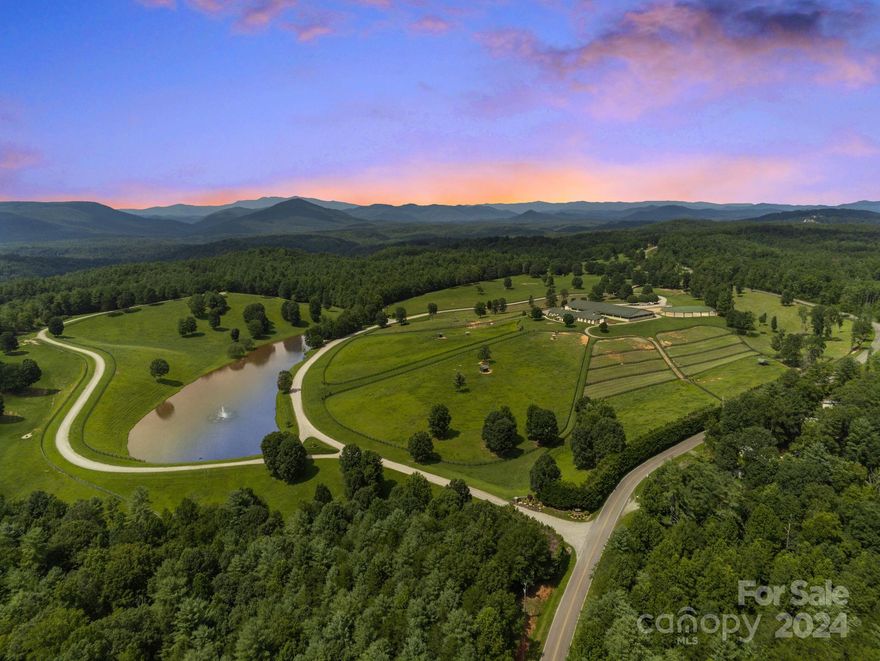 Double C Acres owns 100+ combined world & reserve titles w/American Paint Horse & American Quarter Horse Associations. Champions were bred, raised, & trained at this world-class equestrian estate. Located on 211+ rolling acres in the shadow of the Blue Ridge Mtns. The Equestrian Complex includes a 21-stall barn w/living quarters, attached indoor arena w/11 stalls, pavilion w/hot walker & solid round pen, outdoor arena, expansive parking space, & 70+ acres of fenced pastures/paddocks, each w/electricity & auto waterers. No safety, quality or convenience details were overlooked in building this center; it is unrivaled in NC. From the gated entrance, 8,000+ ft of internal roads connect the Equestrian Complex, private main residence, caretaker home & utility buildings. This pristine estate has 1,615' of Johns River frontage, a 5+ acre spring-fed, stocked pond, numerous creeks & trails. This is an extremely rare combination of natural beauty & property design with unlimited opportunities.