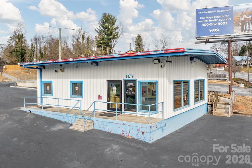 Exciting Opportunity! Rare opportunity for property fronting Patton Ave.  The property contains a charming office building on 0.49 acres, perfect for business or creative space.  This former car dealership office is perfect for a similar business.  It has offices and meeting rooms perfect for many types of business.  120 feet of access from Patton Avenue and 195 feet on Gill street, give this property superb access to this major corridor.

Patton Avenue is a main commercial artery in the Asheville Metro area.  With 25,000 Cars per day at this location and 10,000 rooftops within 1 mile, this location has it all.  The property is in the heart of West Asheville and offers, and HB zoning offers uses such as Retail, Restaurant, Apartments, Brewery, Medical Office, Car wash, Grocery store, all with a drive through possible.  Corner location on Gill Street also adds to frontage and flexibility