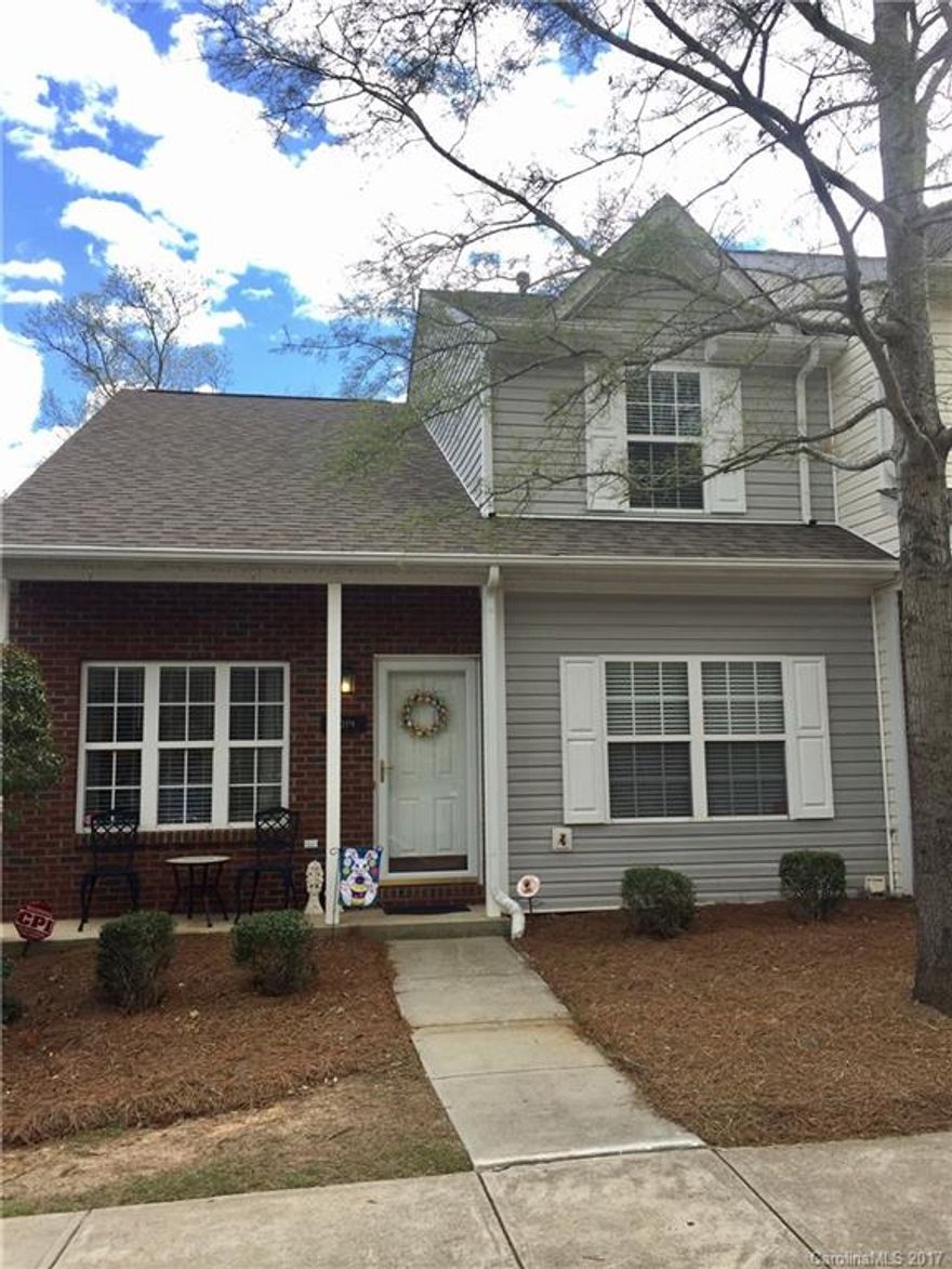 Fall in love with this stunning end unit Town home! Beautiful wood floors throughout the living area and kitchen. All tile bathrooms and laundry room. Like new carpet in bedrooms! Eat in kitchen opens up to a large deck with great wooded view. Family room has gas log fireplace with 2 story ceilings, beautiful wrought iron staircase railing leading to second floor. Upstairs hosts two bedrooms with a large full bath. In the basement enjoy a huge bedroom and walk-in closet, with a full bath!