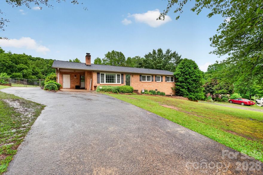 This beautifully updated, all-brick ranch home offers effortless single-level living on an expansive 0.73-acre lot. The interior features a sleek, updated kitchen with modern appliances, a welcoming dining area, a functional built-in office space, and beautifully renovated bathrooms with custom tiled shower surrounds.

?Major mechanical updates offer ultimate peace of mind, featuring a newer roof, HVAC system, mini-split, and hot water heater, as well as being fully wired for a generator. Outside, you'll find a convenient attached carport, a spacious, fully fenced-in backyard with a dedicated storage building, and a walk-in crawl space perfect for extra storage or easy maintenance access. This home perfectly combines modern interior updates, major mechanical reliability, and room to breathe!