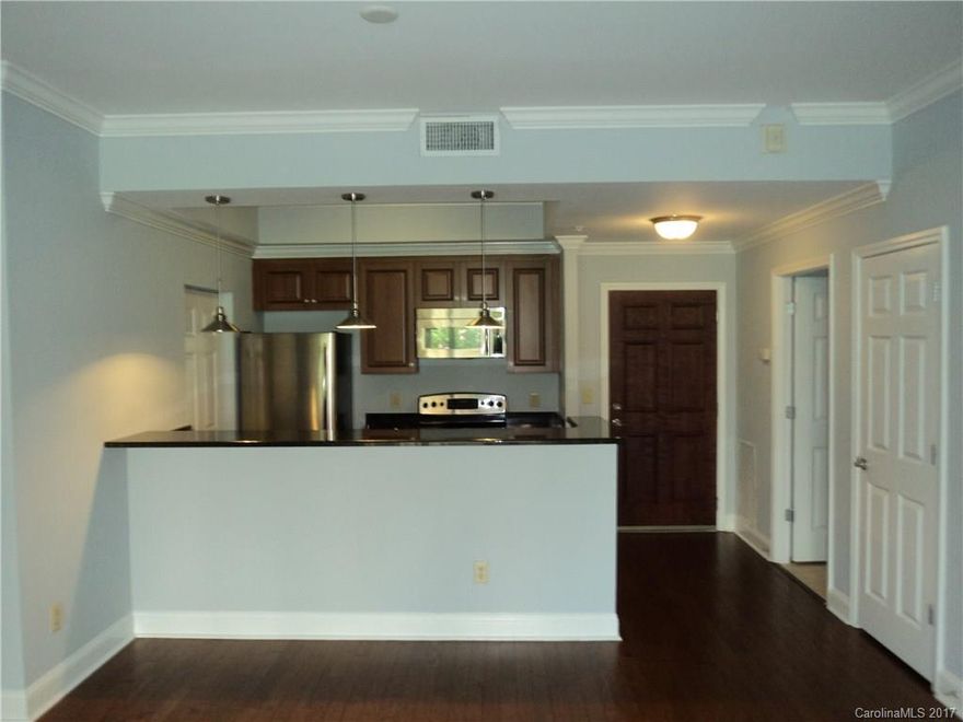 Beautiful condo in ultra-desirable Fifth & Poplar, overlooking a gorgeous 1 acre courtyard w/pool & putting green! Unit has newly refinished hardwoods,fresh paint thru out,new carpet, granite, S/S appliances & a huge columned balcony big enough to be another room! Enjoy 24/7 Concierge Service,Coffee Bar, State-of-the-Art Fitness Center, Business Center, 2 Lounges w/billiards,full media,library,an indoor/outdoor fireplace & a Harris Teeter Market IN your building! Luxury living at its finest!