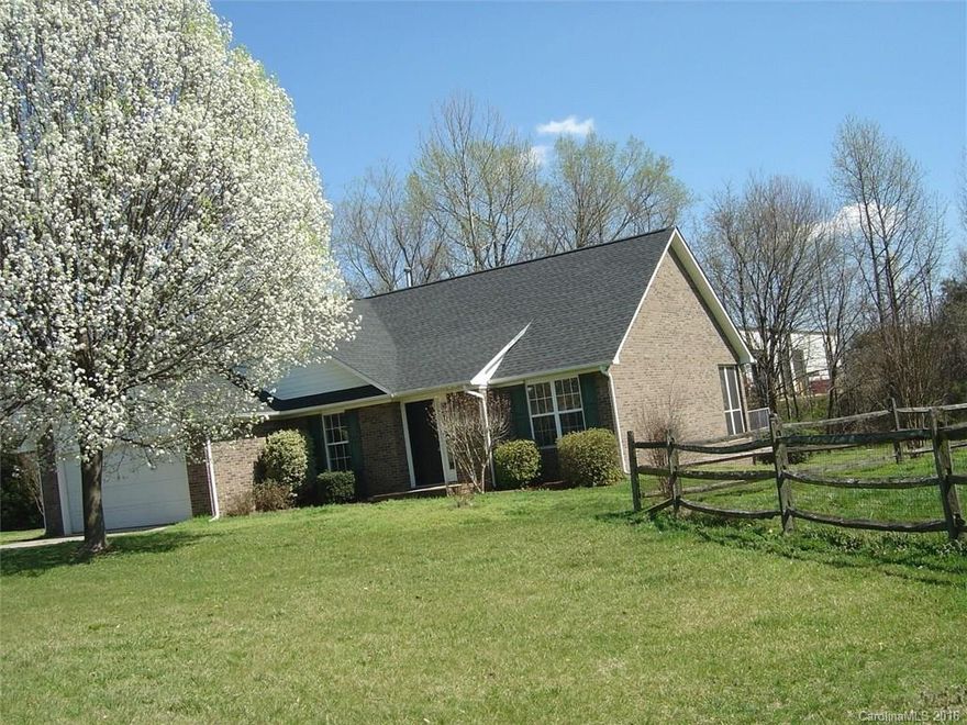 All brick home in the Mooresville school district convenient to downtown & interstate.  House was remodeled in 2013 with new wood laminate flooring in great room, tile flooring in Kitchen, Master Bath & Hall bath.  Tile counter tops in kitchen,  smooth top range, dishwasher.  Master Bedroom has tray ceiling, large walk in closet,  Master Bath with garden tub, double vanity sinks & walking shower. Vaulted ceiling in GR, ceiling fans through.  New roof in 2013. Pull down stairs w/ extra storage.