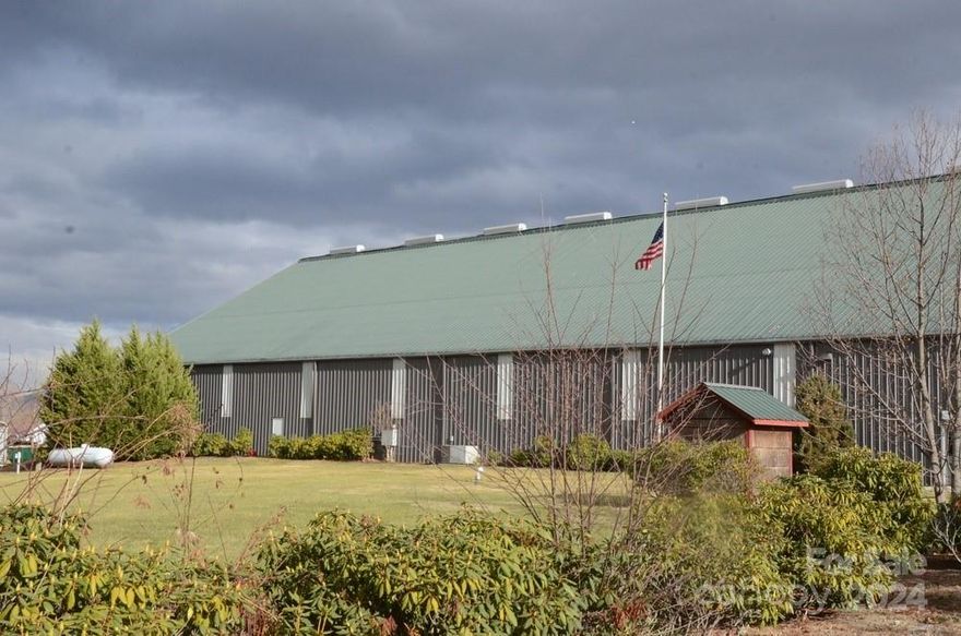 23000 sq ft 50 ft to 18 ft  high ceiling warehouse/ office building- multi use- 17000 sq ft warehouse/ manufacturing space, 6000 office and flex space, 10 offices, 2 conference rooms, fiber optic access, 3 phase power, commercial bathrooms, 2 loading docks, large drive in garage door, kitchen, acreage being sold is 4.5 +/- of the recorded , broker is part owner