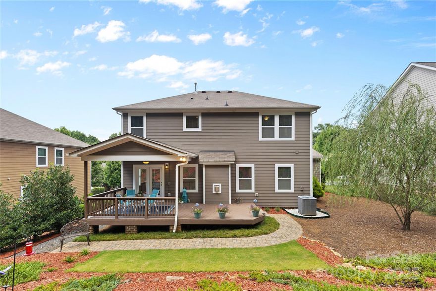 Stunning 2-story brick-front home w/ 5 BRs & 3 full BAs, including main-level guest suite—perfect for multi-gen living. Gourmet kitchen features white shaker cabinets, Caledonia granite, tile backsplash, SS appliances & gas range. Formal dining/office w/tray ceiling, sunny breakfast area + bar seating. Living room offers stacked stone gas fireplace. Elegant hardwood staircase w/iron balusters leads to spacious primary suite w/dual vanities, garden tub, glass shower & huge walk-in closet. Three add’l BRs + large flex/bonus room. Enjoy peaceful views from the covered deck w/ceiling fan, surrounded by trees & nature. Expansive 3-car garage w/overhead storage. Located in sought-after Tuscany w/great amenities: Olympic-size pool, wide streets, sidewalks & clubhouse. Impeccably maintained and perfect for today’s lifestyle. Comfort, quality & convenience all in top rated Cuthbertson Schools. Don’t miss this!