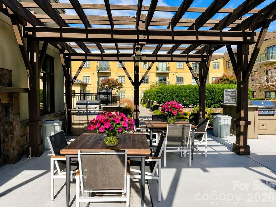 Perfectly positioned in the heart of SouthPark, this sophisticated one-story condo offers an exceptional blend of modern style and effortless city living just moments from Charlotte’s premier shopping, dining, and entertainment. Designed with a bright and open concept, the residence showcases hardwood floors, elevated finishes, and a thoughtfully designed open layout ideal for both everyday living and entertaining. The kitchen features a gas range, stainless steel appliances, stone countertops, and a breakfast bar that seamlessly connects to the main living space. The light-filled living room is anchored by a gas log fireplace and framed by double doors that open to a private balcony—an inviting retreat for morning coffee or evening unwinding.  The spacious primary suite offers a walk-in closet, direct access to a well-appointed full bath, and a discreetly tucked-away laundry area with washer & dryer for added convenience and privacy. Residents enjoy resort-style amenities including a sparkling outdoor pool, grilling terrace, fitness center, and stylish community lounge—perfect for entertaining or relaxing with neighbors. All of this in one of Charlotte’s most coveted neighborhoods, just minutes from SouthPark’s luxury retail, renowned restaurants, and vibrant lifestyle.  Includes one dedicated parking space (#17) conveniently located facing Firebirds, with additional covered parking available beneath the 721 building. Experience stylish, low-maintenance living in one of Charlotte’s most desirable neighborhoods.