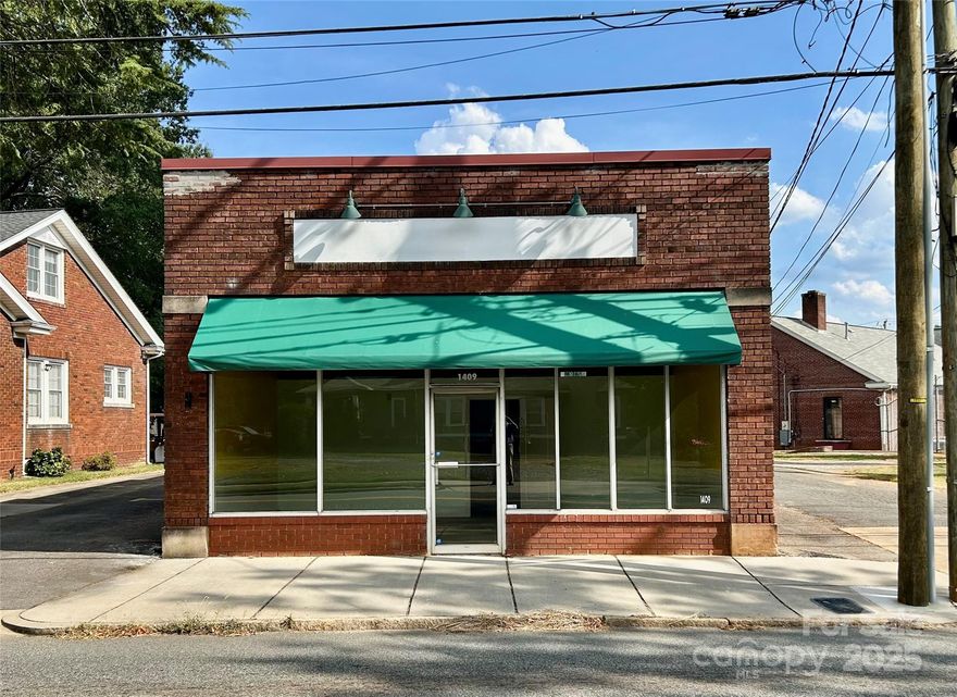 Two buildings, zoned HB (Highway Business) on S. Fulton St, by the desirable Fulton Heights neighborhood.  1409 A is a 1250 Square-foot circa 1925 brick storefront building, set up with a false partition wall that divides the space into a small showroom/lobby area and a larger open space. 220 single-phase electric.  Totally customizable for your intended use. The rooftop HVAC system is approx. 5 years old. 1409 B is a 1680 square-foot cinder block building circa 1959 with a solid wood floor, loading dock, 220 3-phase electric. The Hvac system is also approximately 5 years old. This is a blank canvas, ready for your imagination.  There is a metal container that will come with the property for additional storage.  2 parking spaces are beside 1409A, and 4 parking spaces are behind the 1409B building. Seller will also lease these buildings for $1375 per month for 1409A and $1445 per month for 1409B.