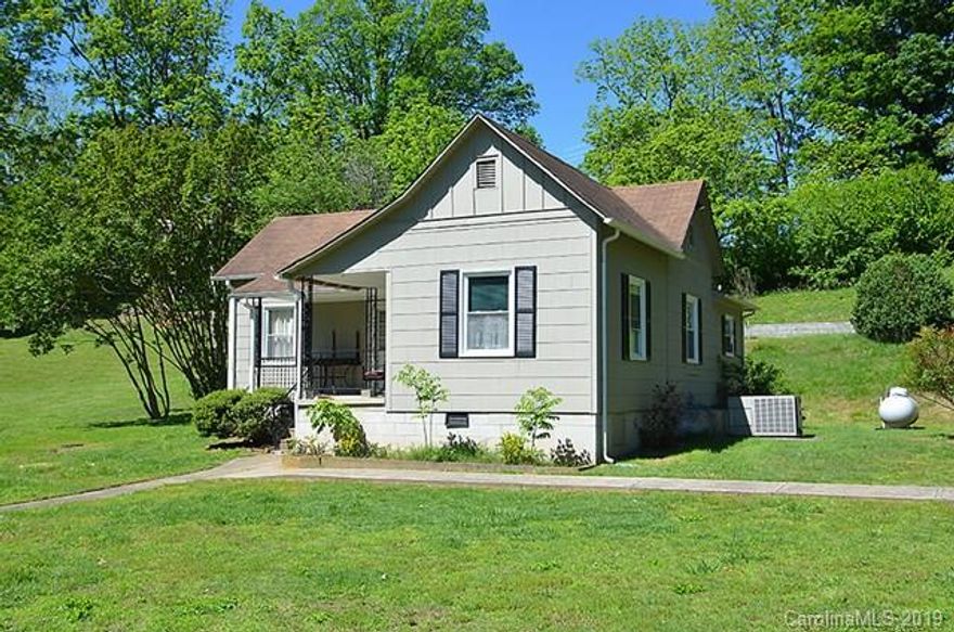 Nice older house in good condition with large living room, 3 nice size bedrooms, 1 bath, large eat-in Kitchen with Range, Refrigerator, Microwave, Washer and Dryer. Replacement windows, nice storm doors with central heating and air condition. Original hardwood floors in living room and 2 bedrooms. Outside freshly painted!  Nice mostly level lot.