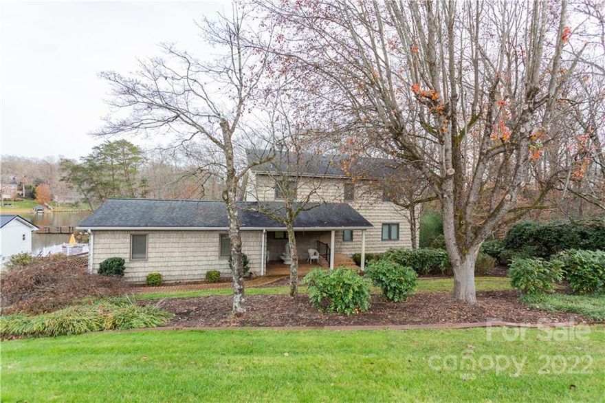 Peaceful, Serene Lake Living! Enjoy the Solitude of a Private Cove & watch Sun-Filled Mornings & Stunning Sunsets from Outdoor Sheltered Patios, Porches or the comfort of a large Enclosed Year Round Sunroom with access to a wrap around Deck w/ Ramp access. Large Master on Main with Jack & Jill Bathroom to Kitchen. Ample Space w/ Walk In Closets & lots of Storage throughout. A Gas Log Fireplace in the Open Concept Living Space can add Heat & Ambiance to any occasion enjoyed from the Main Living Area to the Cozy Loft above.A Full Finished Basement boast another Living Space with Kitchen area, Full Bathroom & Sweeping Lake Views with Entrances & Exits to the Outdoor Living spaces. Hardwood floors & carpets throughout. Two Hot Water Heaters. Custom Jetted Tub w/Jacuzzi Shower Head & Clear Glass Fitted Enclosure on Main Floor. Newer Eagle Sunrise 300 lb Chair Lift to Dwnstrs. Dbl Deck Boat Slip & Enclosed Boat House. Double Garage & a Single Carport. Too much to mention, a must see!