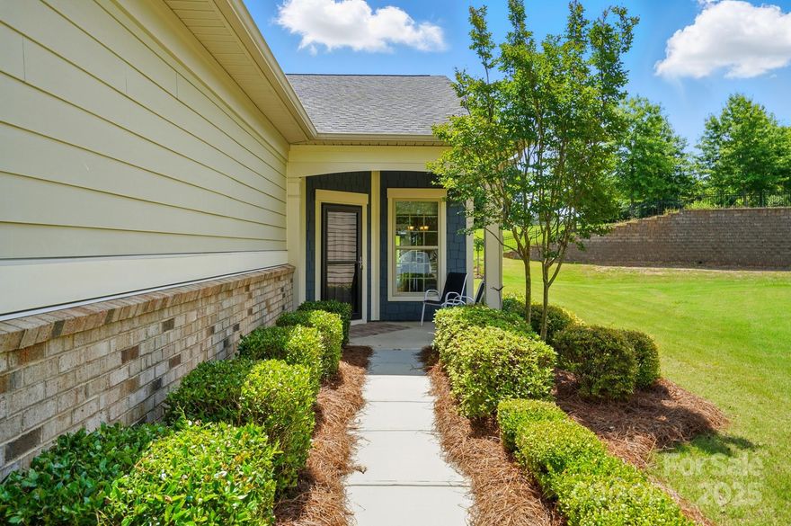 Welcome to your new home in the vibrant community of Carolina Orchards. This beautifully maintained 2 bedroom/2 bath residence offers single-level living with rare walk-up attic space for additional storage. Situated on an oversized cul-de-sac lot, you can enjoy quiet Carolina evenings from the screened porch or the beautiful patio space. The thoughtfully designed open-concept layout has just been freshly painted. The kitchen is the true heart of the home and features white cabinets, granite countertops and a large center island. Stainless steel appliances include a gas stove and a raised-height dishwasher. Enjoy the low-maintenance benefits of this community and take advantage of all the resort-style amenities that are offered. Clubhouse, fitness center, indoor and outdoor pools, pickleball, tennis courts, walking trails, and a community calendar filled with social events and activities. Conveniently located near shopping and restaurants. Come live the Carolina Orchards lifestyle!