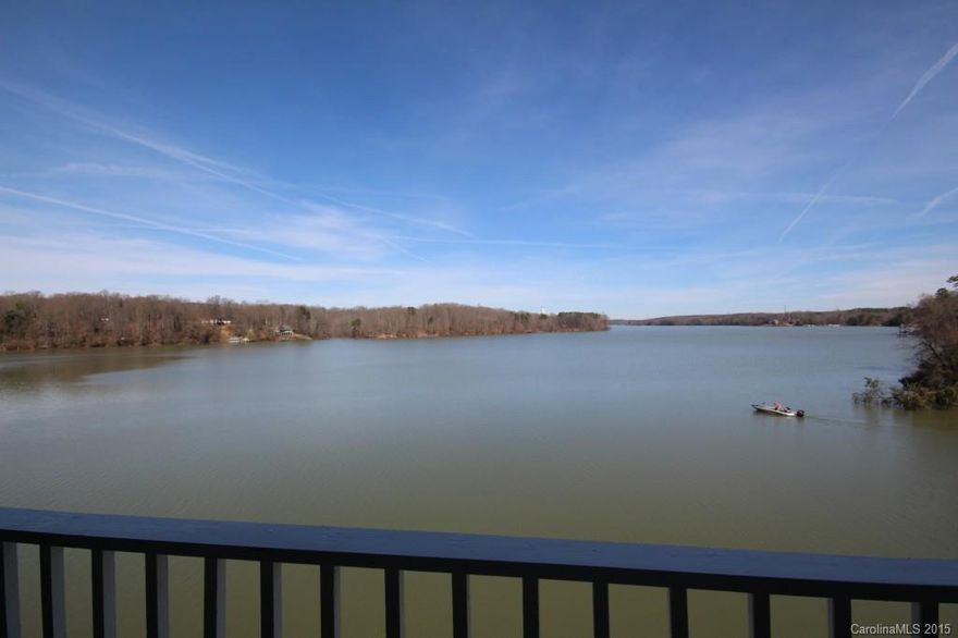 Waterfront end unit w/breathtaking views of Lake Wylie and Brown’s Cove. Enjoy beautiful water views from every room of the open floor plan, and your private Covered Porch. Master bedroom w/bay window, dual vanity sinks, whirlpool tub, sep shower, walk-in-closet, and wall of cabinets. 2nd Bedrm custom built-in desk, cabinets, & book shelves great for office. Great community w/pool, boat dock & BOAT SLIP. Affordable waterfront living w/all the luxuries of a resort!