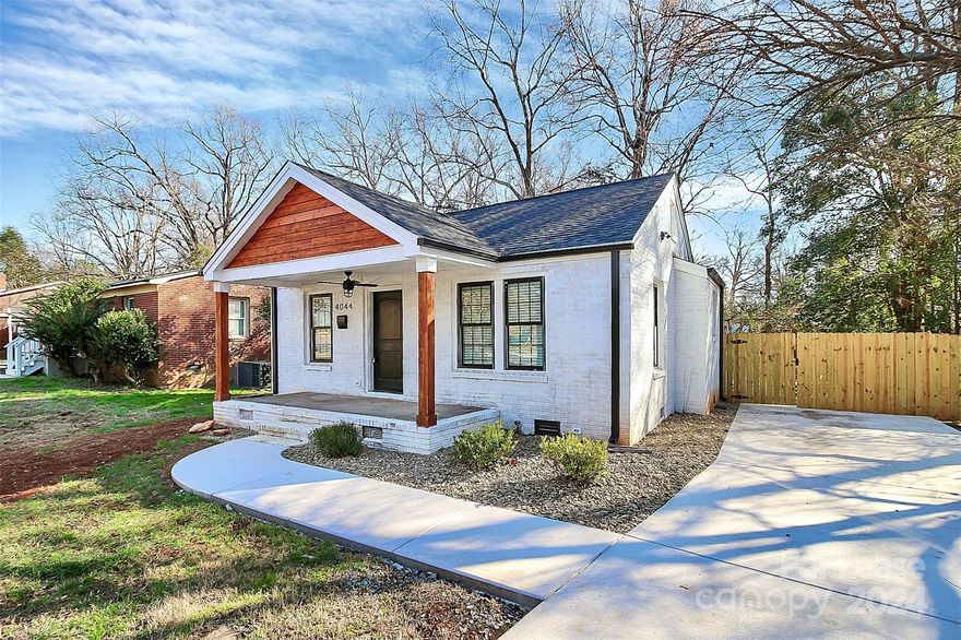 Immaculately renovated 1940's bungalow for rent, bursting at the seams with charm + character! Fit for modern living this 3 bed/2 bath home has modern finishes found throughout, and features brand new LVP flooring, a freshly painted interior, stunning kitchen + upgraded bathrooms! Upon entering through your covered front porch, you're welcomed into the spacious + light filled living room, which is open to your kitchen. With open shelving, ss appliances + a trendy subway tile backsplash, you'll love cooking your favorite meals at home! Continuing on, the primary bedroom offers you private access to your brand new back patio overlooking your large backyard, + features a beautiful en-suite bathroom. The two remaining secondary bedrooms are sizable + share another updated full bathroom. Situated close to Noda, Plaza Midwood, Uptown + Optimist Park have to offer you, this location can't be beat!