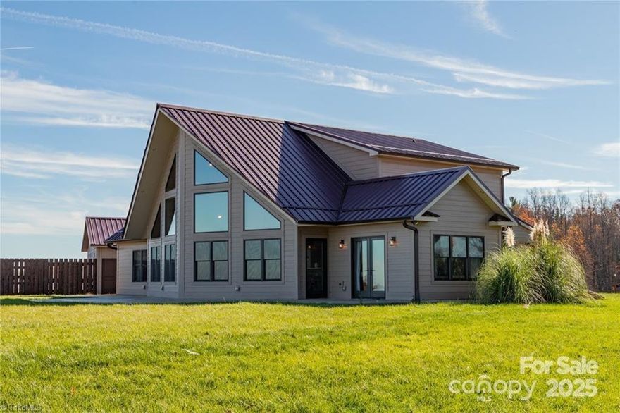 Nestled in a serene and private location, this 3 BR / 2.5 BA home offers unparalleled long-range mountain views. This home is the location of "Beloved Homestead" a well known wedding & event venue. From the moment you step inside, you’re greeted by expansive windows framing panoramic vistas of rolling peaks and verdant valleys that stretch for miles. The open-concept floor plan enhances the sense of space, with natural light pouring in and highlighting the fine finishes. The cozy great room features a soaring stone fireplace, with a mantle from an 1800s Pennsylvania bank barn salvaged and restored by Alex Webb of Barnwood Builders TV show. All of the crew members also signed the mantle. This impressive living space is ideal for chilly evenings, while the large patio and pavilion invite outdoor living at its best, perfect for entertaining or simply soaking in the views. Whether you seek a full-time residence or a getaway, this home is the perfect place!