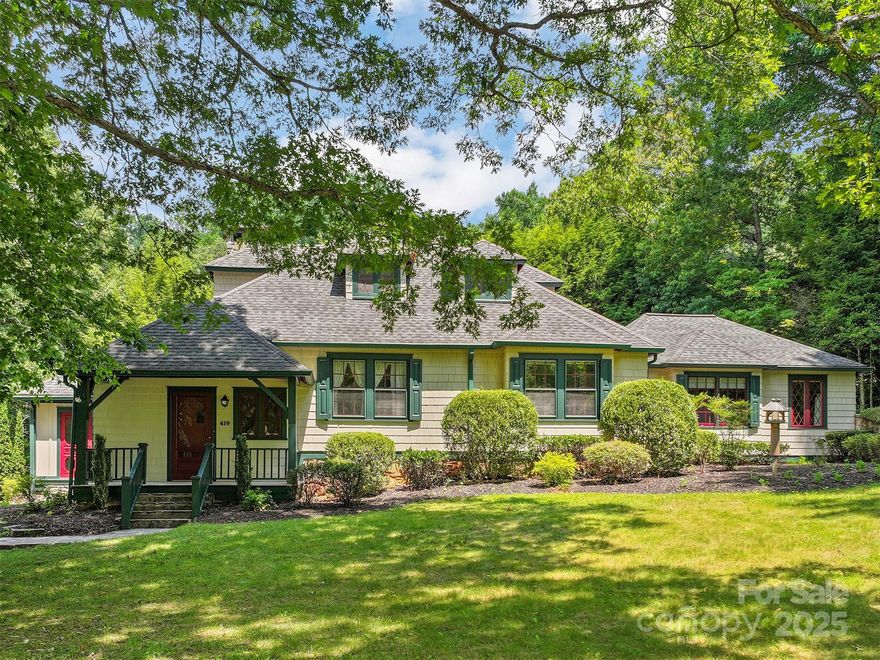 A Rare Treasure Overlooking Waynesville Inn and Golf Club.Blending old-world charm with thoughtful modern updates, the home gleams with hardwood floors, arched doorways, and an abundance of natural light. The updated kitchen features granite countertops, custom cabinetry and a dining area with views of the gardens.
The spacious living room and dining room exude classic warmth, while the primary suite is a private haven, opening to a covered porch and featuring a spa-like bath, walk-in shower, and custom built-ins. Media Room, two guest bedrooms and a beautifully updated bath complete the main level.Upstairs, two ensuite bedrooms showcase original wormy chestnut paneling, adding rich character and texture. The lower level offers a full bath, canning kitchen, workshop, potting area, and a plethora of future potential.
Perfectly situated just minutes to Waynesville, this home offers a lifestyle of grace, comfort, and enduring beauty. A truly rare offering—filled with history and heart.