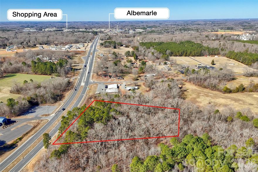 Commercial Lot for Sale on NC Hwy 24/27 in Albemarle NC.  This site has been rezoned to General Business (GB) which allows for a multitude of uses.  This property is convenient to downtown Albemarle and just a few minutes from Lake Tillery.    Please review the Stanly County and Albemarle zoning departments for more information on allowable uses.  The property does have approximately 375 feet of road frontage.  Currently the site does not have sewer so the property will need to be evaluated for a suitable septic system for the new buyers use.