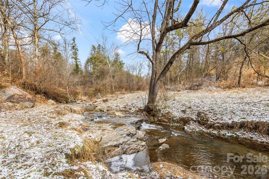 Discover this 1.57 acres of peaceful creekfront land in Marshall, offering a rare combination of flowing water, privacy, and flexibility. The main build area is accessed by crossing the creek, allowing the future owner to design and build a bridge to enjoy natural separation from the road. This beautiful land offers a quiet, natural setting while remaining a short drive to downtown Marshall. All of this, and you'll be about 20 minutes from Weaverville, where the new Advent hospital is being built.