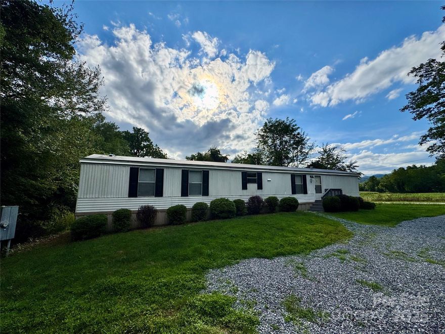 Welcome to 6 Davidson Road, a fantastic opportunity to own a charming property with a two-bedroom, two-bathroom manufactured home in Swannanoa. This home features new flooring throughout and sits on a peaceful lot.
Its prime location puts you just minutes from the vibrant towns of Black Mountain and Asheville, with easy access to outdoor activities and local amenities. It is also conveniently located near Warren Wilson College and Montreat College.
Whether you're looking for your next home or a smart investment, this property offers incredible potential in a serene setting. The manufactured home is to be sold as personal property, unless otherwise negotiated with the seller.