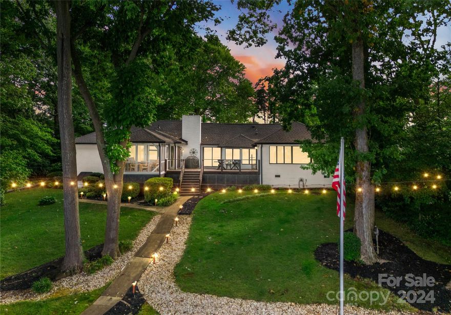 Incredibly RARE ranch style home in the heart of Denver. This home is nestled within the Westport Peninsula and offers BIG main channel views with OVER 220 feet of shoreline! This 4BR, 3Bath property boasts  extensive updates and water views throughout all of the main living areas. Some updates include a fully renovated kitchen, all new wood style flooring, new guest bathroom, newer roof & newer HVAC, with new thermally modified exterior decking built to last over 40 years! Layout is open and airy with a fresh coat of paint and offers plenty of space to relax and enjoy a sunny afternoon on your private back sunroom or screened in porch. Exterior offers tons of privacy, and oversized dock with boat lift to keep all of your lake toys ready to use! Minutes from Dog Island by water, and conveniently located in the heart of everything the west side of the lake has to offer. Come tour this beautiful property today and you will not be disappointed!