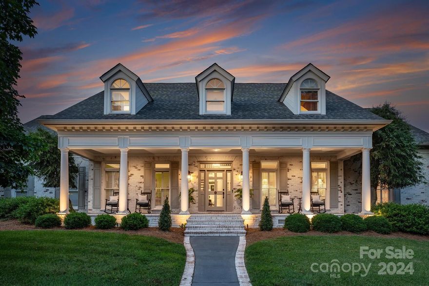 Straight out of Architectural Digest!! This immaculately maintained full-brick home is located just off the 1st Green of the Highly Regarded Peninsula Golf Club.  A beautifully designed 5-bedroom home (w/Primary Suite on main fl) has a fully appointed chef's kitchen w/an open floor plan leading to a spacious great room; both, of which, feature floor to ceiling windows looking out to the expansive outdoor covered living area, (w/outdoor TV, ceiling fans, custom stone fire pit). The lrg flat yard provides the perfect combination of privacy while also allowing for direct access & a view of the golf course.  Along w/ 4 add'l bedrooms/2 full bathrooms on the 2nd floor, you will find a lrge bonus/media room, flex room/office, a 2nd oversized laundry room w/built-in storage.  This Cul-de-sac street is centrally located between the golf & yacht clubs and located in a highly desirable school district.  NEW in 2024- Architectural Roof ~ Remodeled Primary Suite ~ Full moisture barrier.