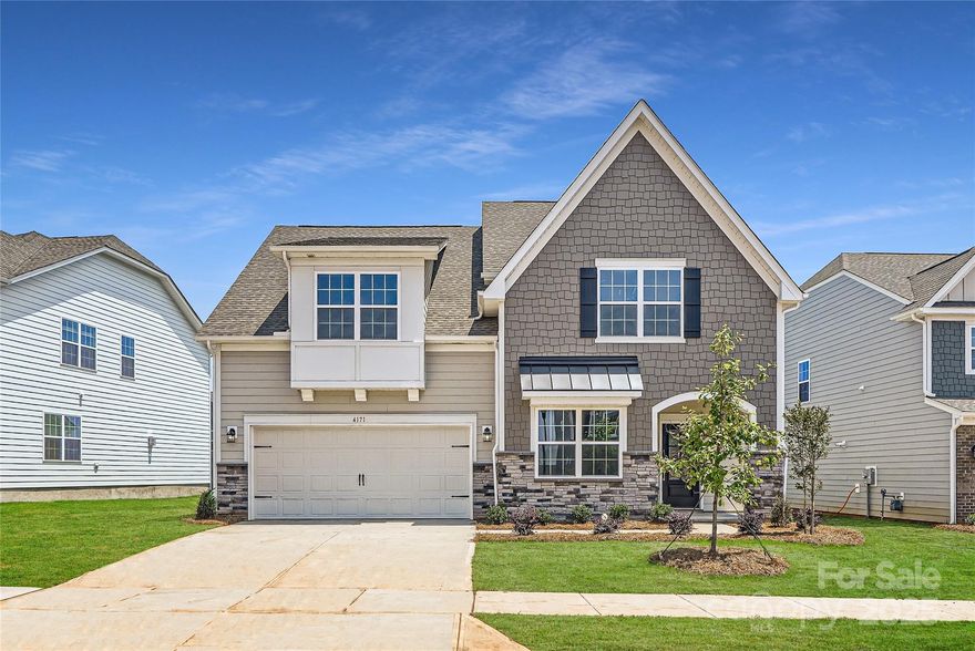 This two-story home is optimized for gracious living with features such as a gourmet kitchen and fireplace. On the first floor, the owner’s suite is tucked in a back corner for added privacy. The open-plan kitchen, breakfast nook and family room open out to the patio, and a flex room can be made into an optional study. Upstairs are three secondary bedrooms and a loft. Plus, our signature Everything's Included program means you will get quartz or granite kitchen countertops, subway tile backsplash, ceramic tile, and luxury vinyl plank flooring at no extra cost! Welcome to Elizabeth, a sought-after master-planned community located in the heart of Fort Mill, offering 7 collections of new homes. Future amenities include a swimming pool, clubhouse, fitness center, sport courts, playground, walking trails and more. This community offers close proximity to highly rated schools, dining and recreation, plus it's conveniently located just 19 miles from uptown Charlotte.