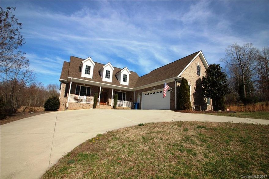 Custom All Brick Home on 2.54 Acres!  This home features  Hickory Wood floors in the foyer, hallways, office, living room, breakfast, & kitchen.  Vaulted ceilings in the Great Room.  2 gas Fireplaces.  One in the great room & one outside on the back porch.  Huge master suite with lighted tray ceilings, 2 walk in closets, double granite vanity, huge shower, and garden tub.   600 Sq ft unfinished room on the 2nd floor.  Basement features an oversized 606 sq ft 1 car garage & plenty Storage.